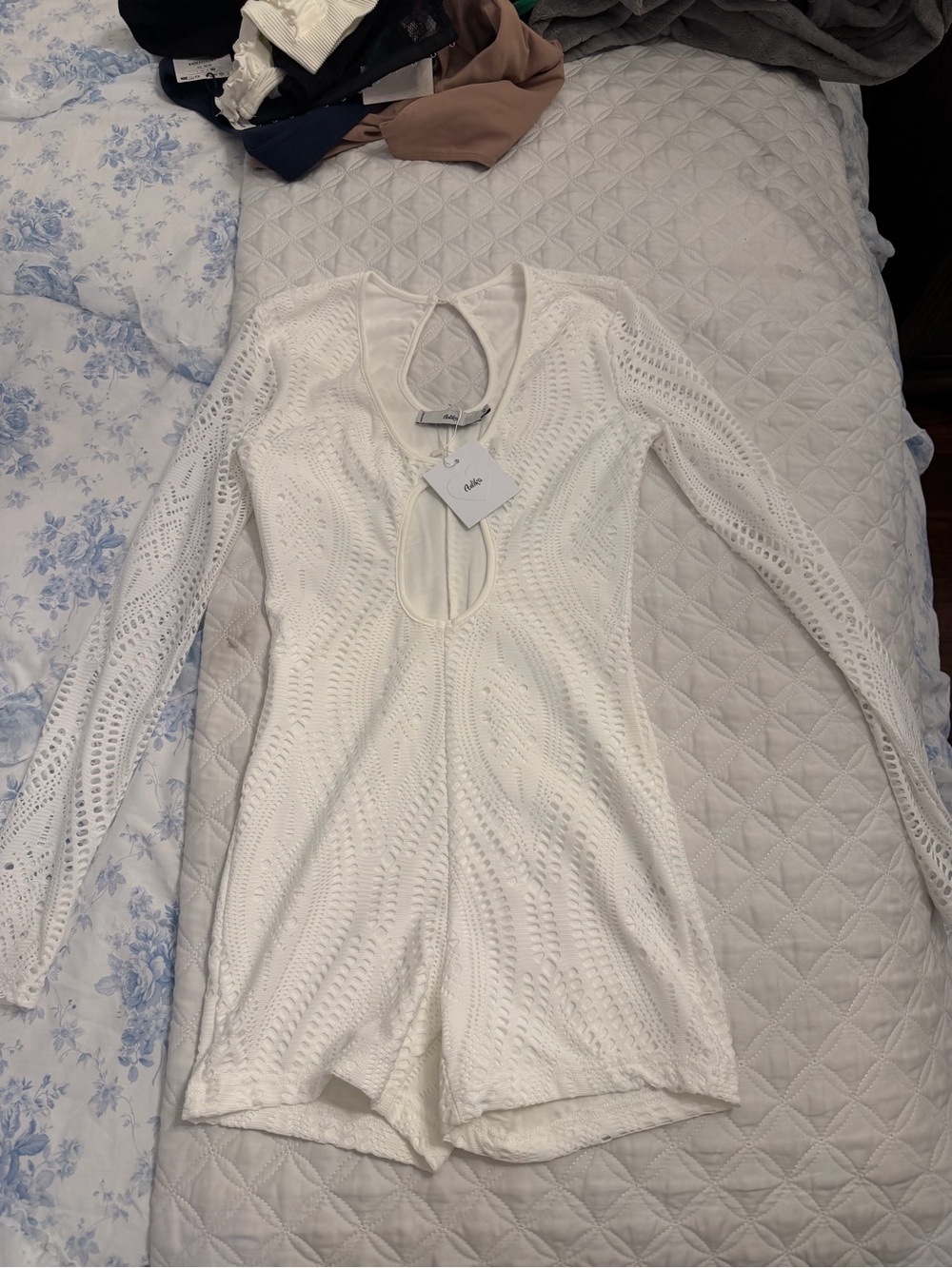 Adika White Long-Sleeve Knit Romper with Front Keyhole